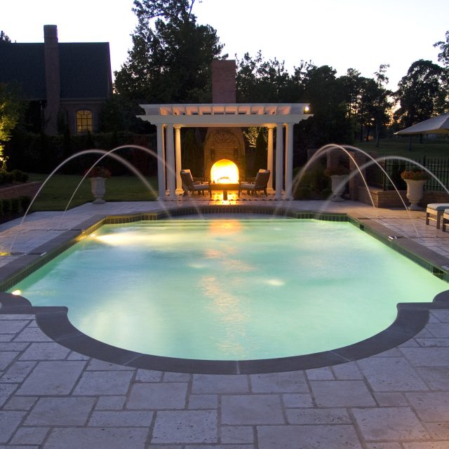 luxury pool with water spraying