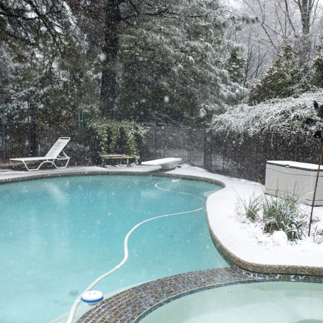 Backyard Winter Pool in Snow