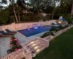 Thumnbail of luxury pool with retaining wall and water features