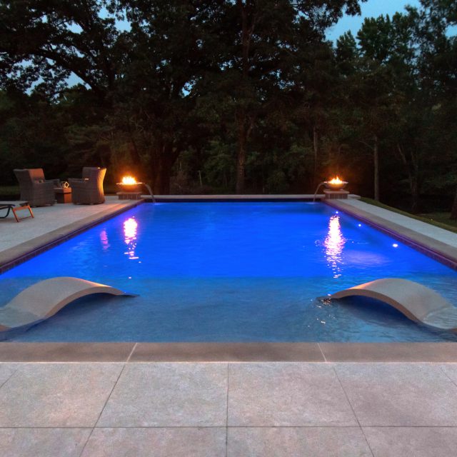 luxury pool at twilight with chairs