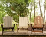 Thumnbail of wooden outdoor furniture in serene woodland setting